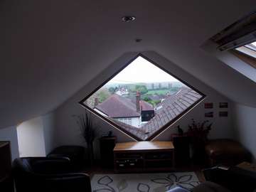 Heswall, wirral. Shaped Timber window, manufactured from Red Gradis engineered Hardwood. Prepainted to any Ral Colour .